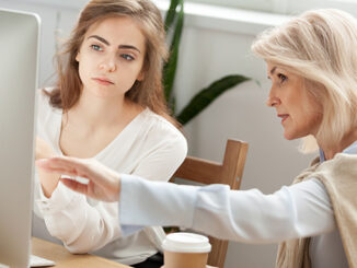 Woman coaching a girl on a new business opportunity